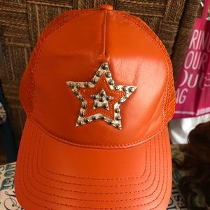 Wilsons Leather orange leather hat.